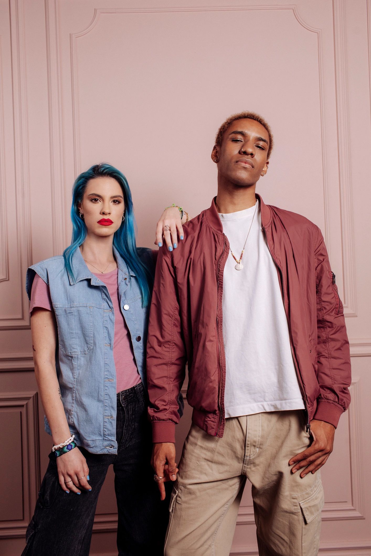 Stylish portrait session with two adults against a soft pink backdrop